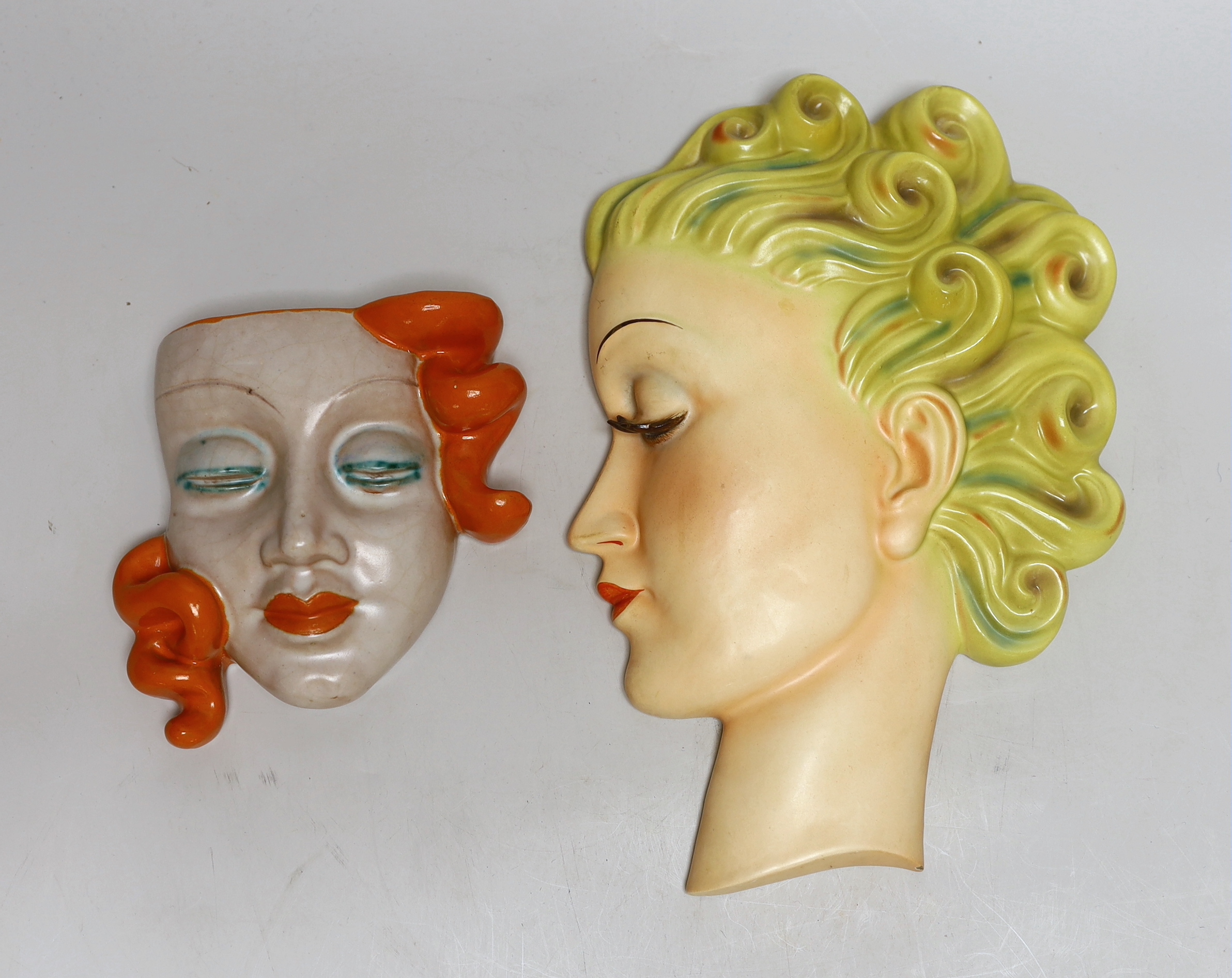 A Goldscheider wall mask and another, designed by Agnes Richardson, largest 29cm